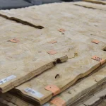 Stack of White Ash burl veneer sheets on a pallet