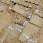 Warehouse pallet with packs of olive ash burl veneer 0.6 mm.