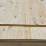 Oak wall panels, parquet knots, 19 mm, 1033x2800 — panels stacked in storage