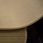 Cut surface of flexible MDF with precise slots above the stack