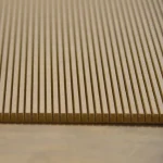 Detailed shot of the grooved flexible MDF texture