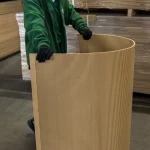 Bent flexible MDF board against warehouse racks