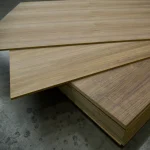 Stack of veneered MDF boards American Walnut in the warehouse