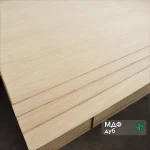 Stacked MDF boards veneered with sawn oak veneer 4 mm in a warehouse