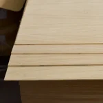 Edges of thin 4 mm MDF sheets veneered with sawn oak veneer