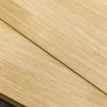 Texture of natural sawn oak veneer on the MDF board surface close-up