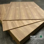 Veneered MDF boards with American Walnut 19 mm in a stack at the warehouse