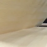 Lifting a white ash veneered MDF board sheet