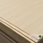 Corner of a 4mm MDF board veneered with white ash in a stack