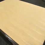 MDF board veneered with white tangential Ash, 19 mm, 2800x2070 — boards stacked in storage