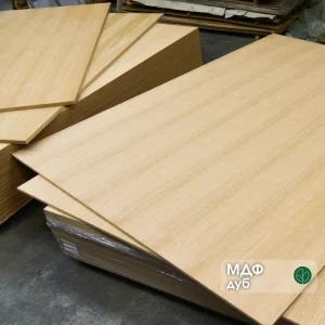 Veneered MDF board with sawn oak veneer 17 mm in a stack at the warehouse