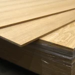 Pallet of 17 mm MDF boards with sawn oak veneer in protective wrap