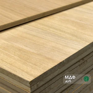 Corner of MDF board faced with sawn oak veneer 19 mm in a stack.