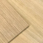 Texture of natural sawn oak veneer on the MDF board surface.