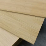 Detailed view of three overlapping oak veneered MDF boards.