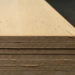 Edges of 19 mm veneered MDF boards stacked, showing material thickness and density.