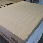 Pallet of white ash veneered MDF boards in the warehouse