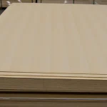 Veneered MDF sheets white ash in a stack on a pallet