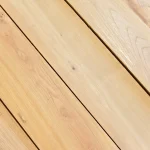 Close-up texture and grain pattern of sawn acacia veneer