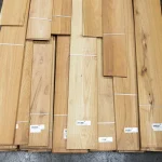 Bundles of sawn Acacia veneer with barcode labels, top view