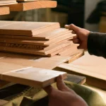 Sorting and checking sawn Acacia veneer sheets in the warehouse