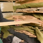 Selecting sawn elm veneer sheets from the rack at the WoodWay Expert warehouse