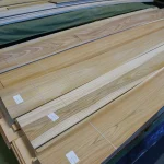 Packs of sawn elm veneer on a warehouse pallet