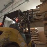 Forklift moving wood materials at the WoodWay Expert warehouse