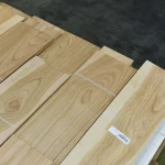 Sawn cherry veneer laid out for inspection