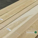 Sawn cherry veneer sheets 4.5 mm thick in bundles in a warehouse