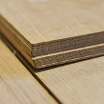 Edge close-up showing the 2.5 mm thickness of sawn oak veneer.