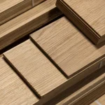 Ends and edges of sawn oak veneer packs on a pallet