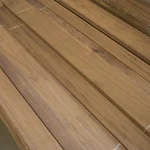 Long lamellas of sawn American Walnut veneer laid out on a pallet.