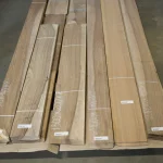 Packs of sawn European Walnut veneer on a pallet with marked dimensions