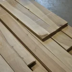 Sheets of sawn European Walnut veneer stacked on a pallet