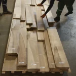 Sorting of sawn European Walnut veneer by workers in the warehouse