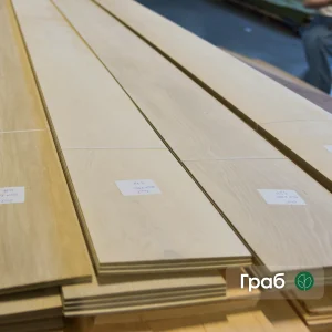 Sawn hornbeam veneer sheets 2.5 mm thick stacked in packs.