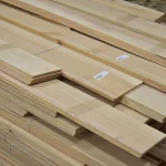 Stacked bundles of sawn ash veneer at an angle