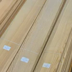 Long sheets of sawn ash veneer with labels