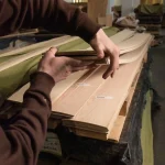 Demonstration of flexibility and thickness of sawn ash veneer in hands