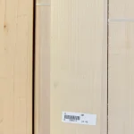 Close-up of light-colored sawn maple veneer texture with a barcode.