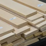 Pallet with packs of sawn maple veneer of various lengths.