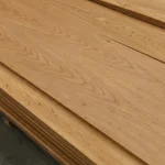 A stack of 2.5 mm Amur Cork Tree sawn veneer sheets showing natural wood grain.
