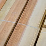 Natural texture and annual rings of sawn pine veneer.