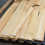 Bundles of sawn pine veneer on a wooden pallet