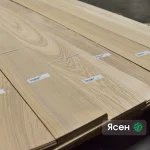 Sawn ash veneer 2.5 mm thick laid out in a warehouse.