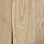 Texture and natural grain pattern of sawn ash veneer.
