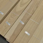 Sheets of sawn ash veneer with barcode labels.