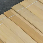 Packs of sliced Anegre veneer 0.6 mm stacked on a pallet