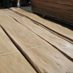 Long sheets of first grade sliced elm veneer stacked in packs